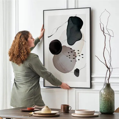 Woman hanging the Canvas Optimized